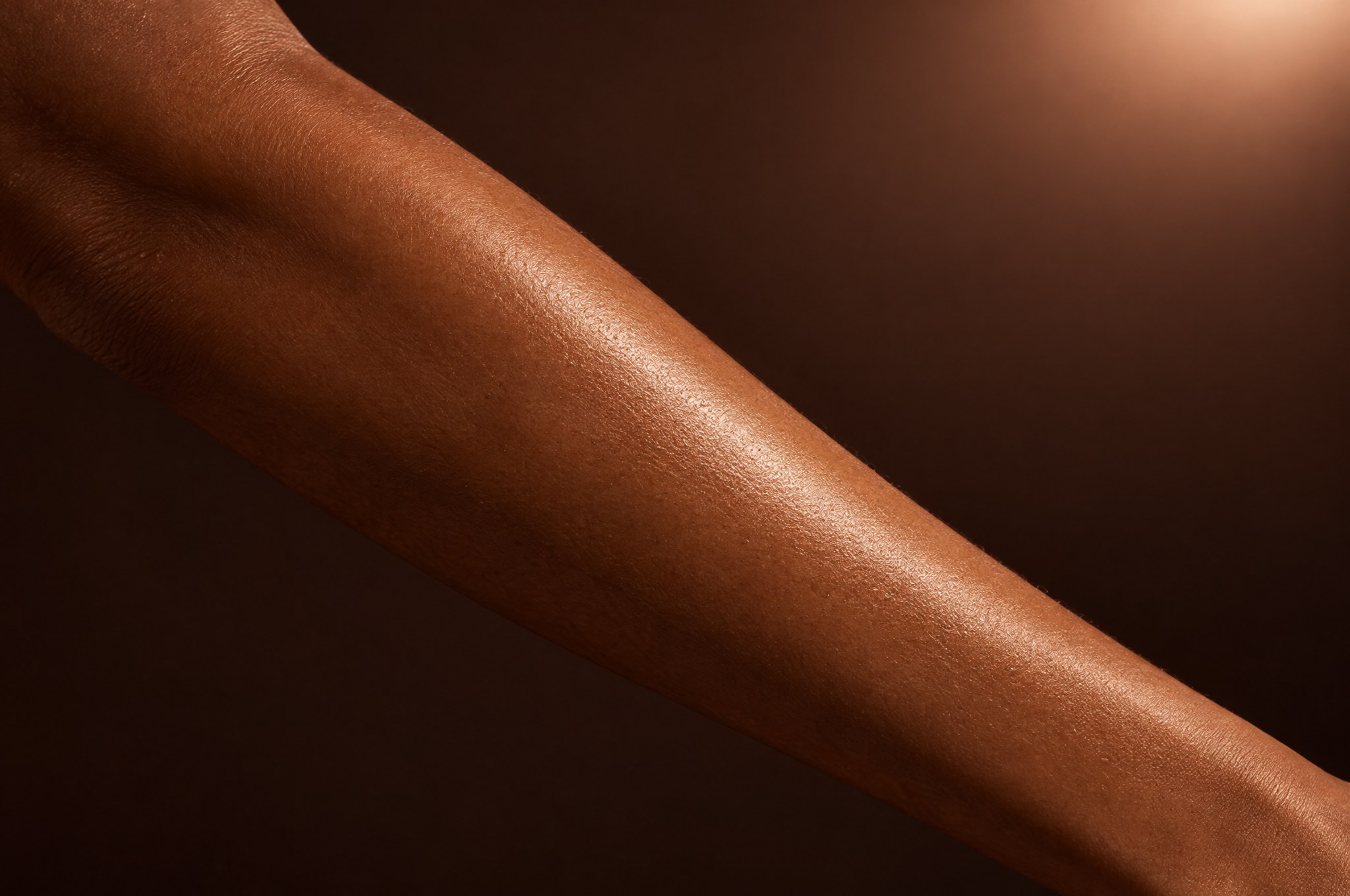 A smooth forearm with a silky sheen, the Half Arm Wax at Glo Haus by Alanii, Orlando